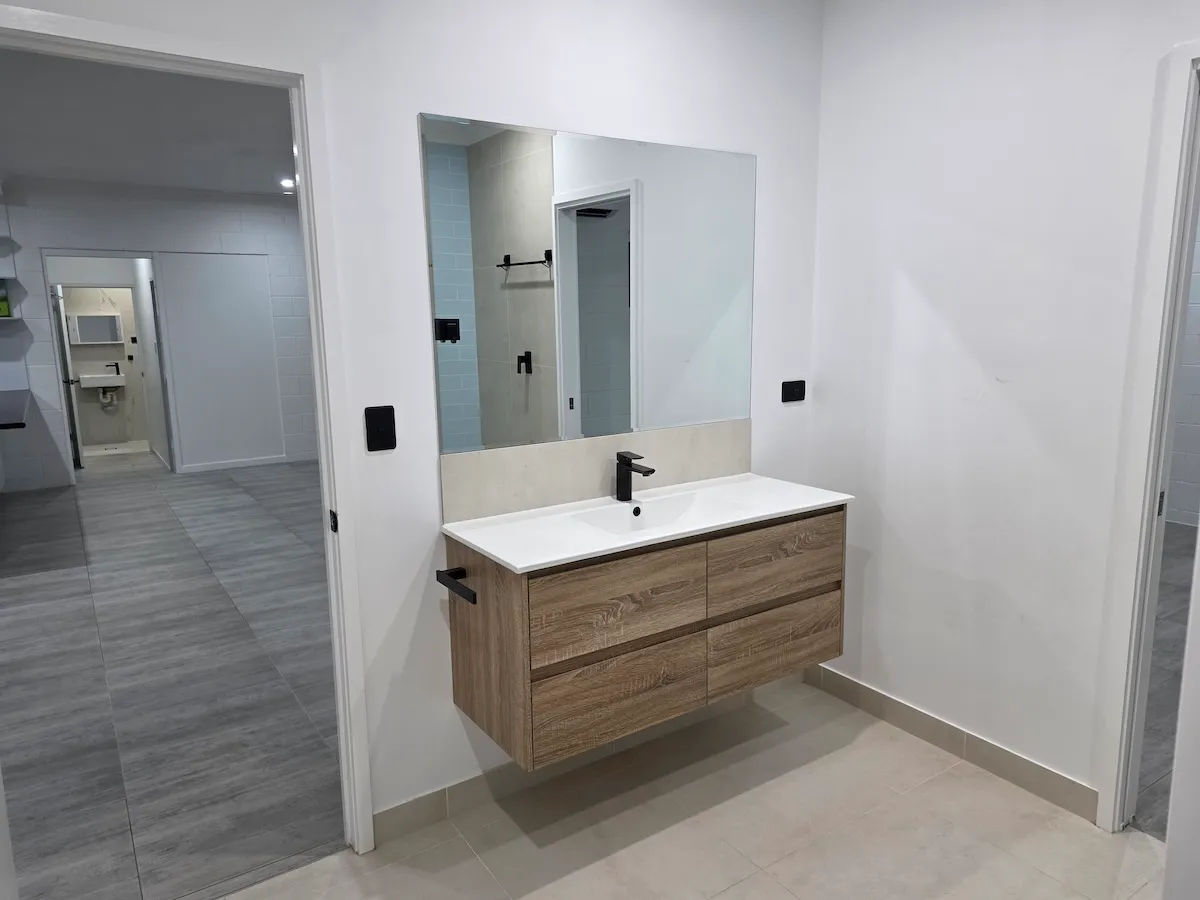 Bathroom vanity and mirror after a detailed clean